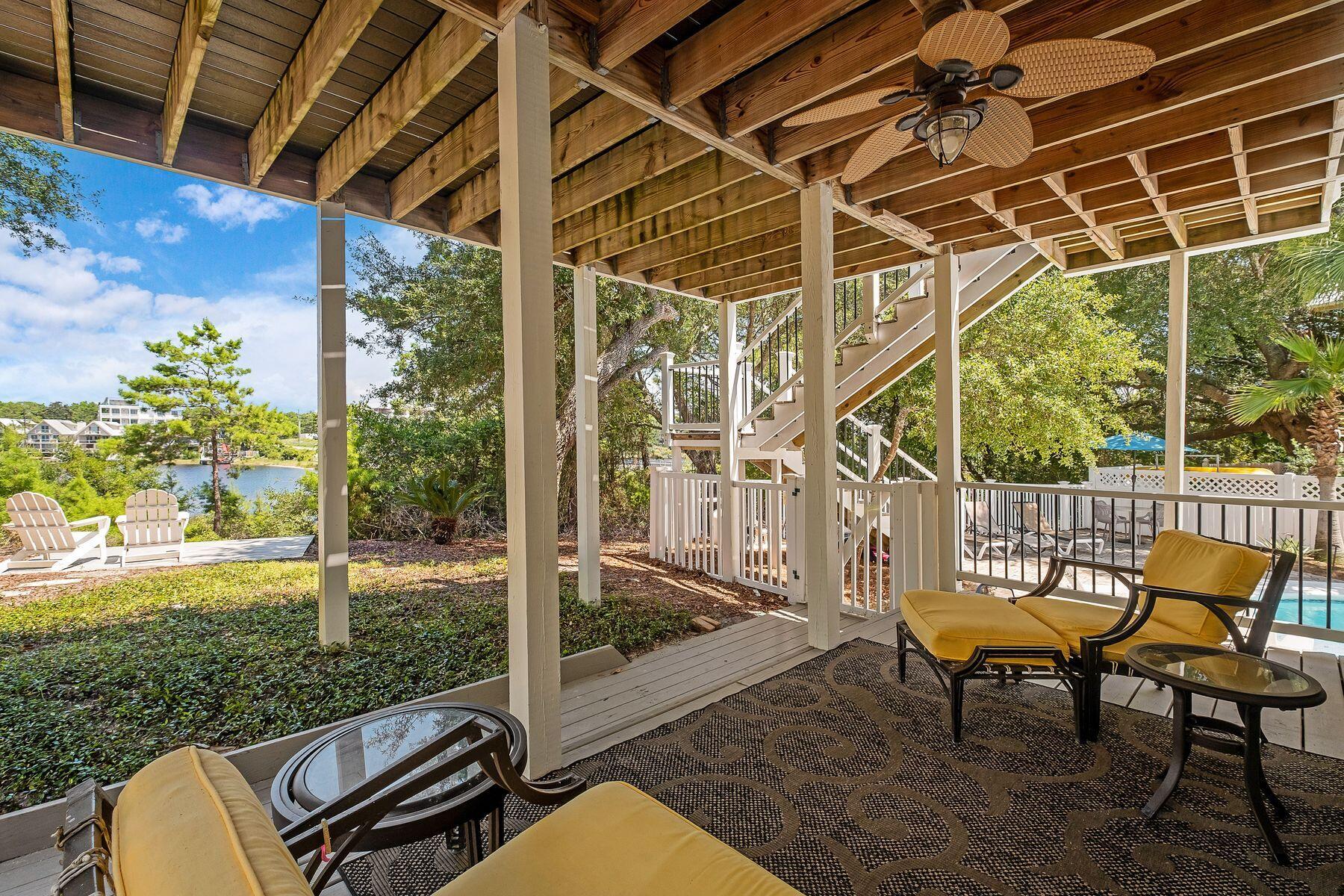 363 Pelican Circle Inlet Beach, FL 32461 - Photo 61 of 80 a view of a chair and table in patio with wooden fence
