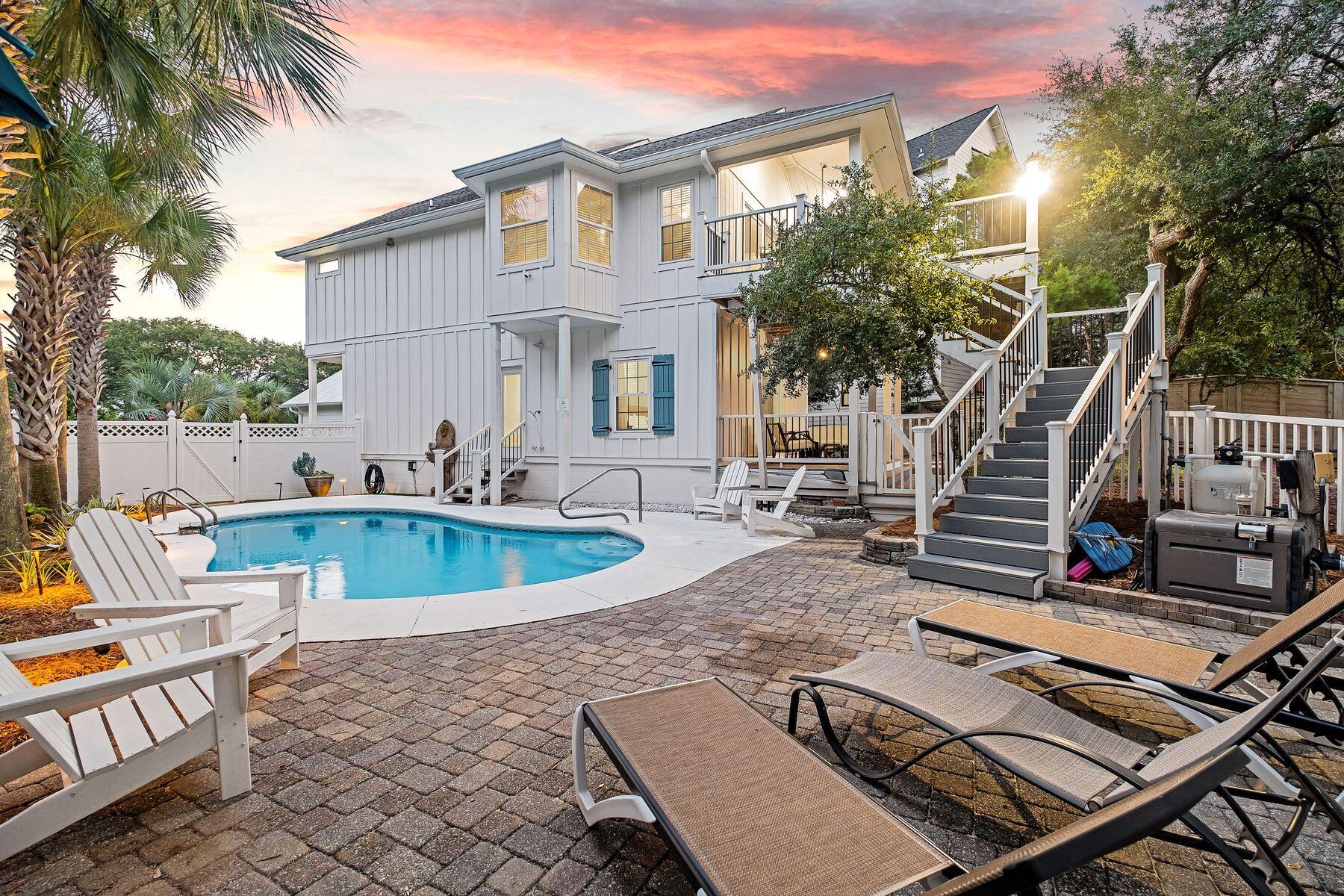 363 Pelican Circle Inlet Beach, FL 32461 - Photo 8 of 80 a view of a patio with couches table and chairs and potted plants