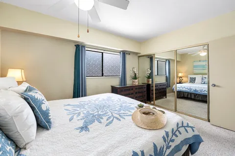 a bedroom with a bed and window