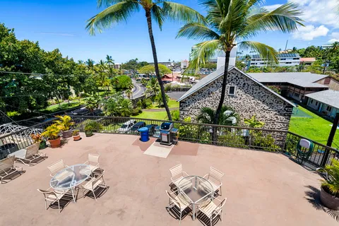 a view of a backyard with a sitting area