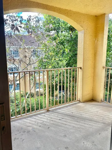 a view of a street from a balcony