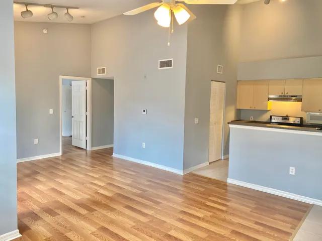a view of a kitchen cabinets and a room