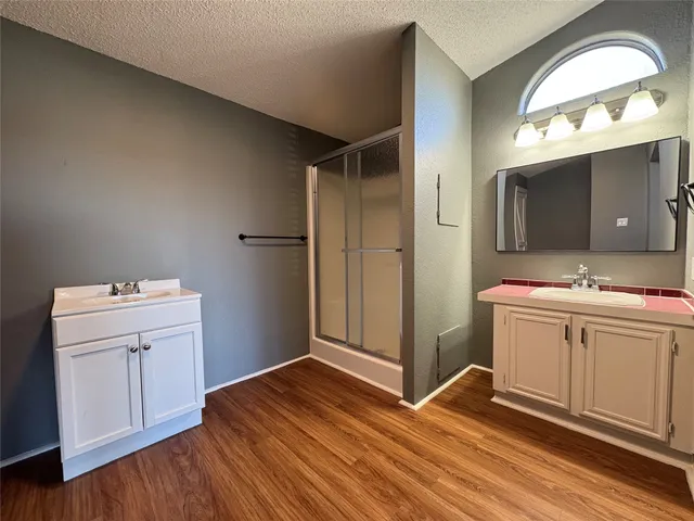 a room with a bed and a flat screen tv