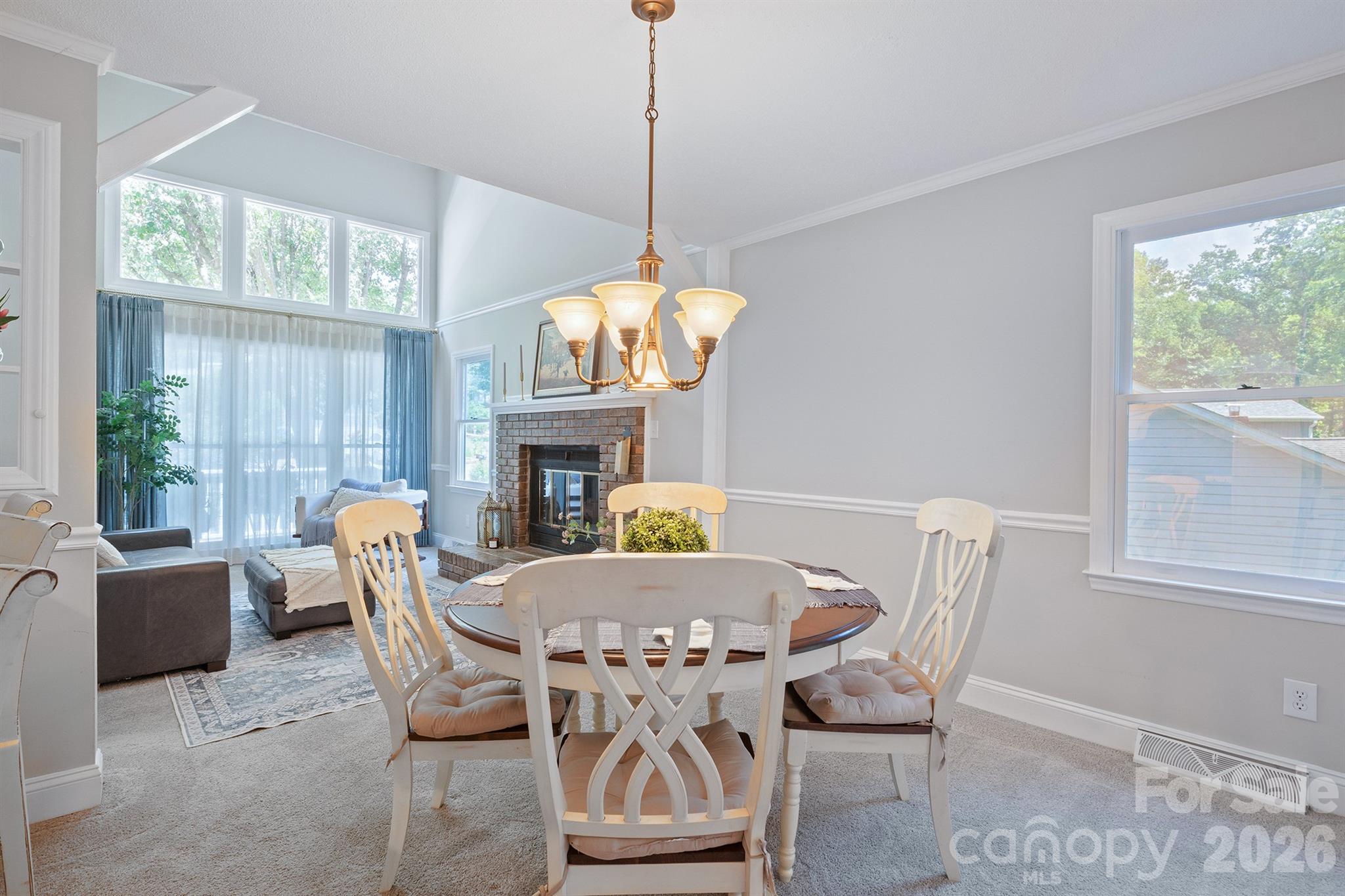 19017 Kailua Circle Tega Cay, SC 29708 - Photo 4 of 46 a view of a dining room with furniture window and outside view