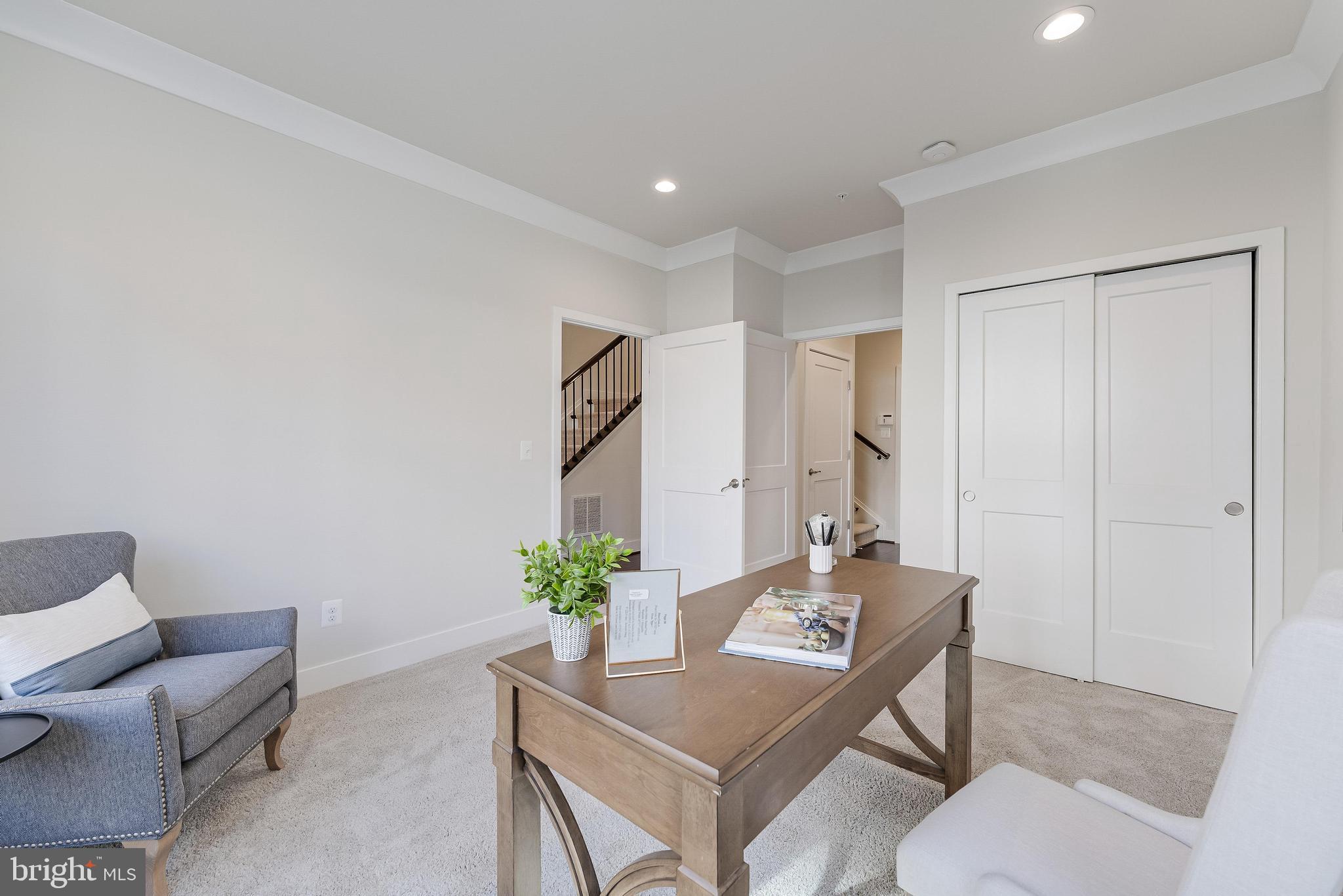 11695 Sunrise Square Place Reston, VA 20191 - Photo 11 of 72 a living room with furniture and flowers