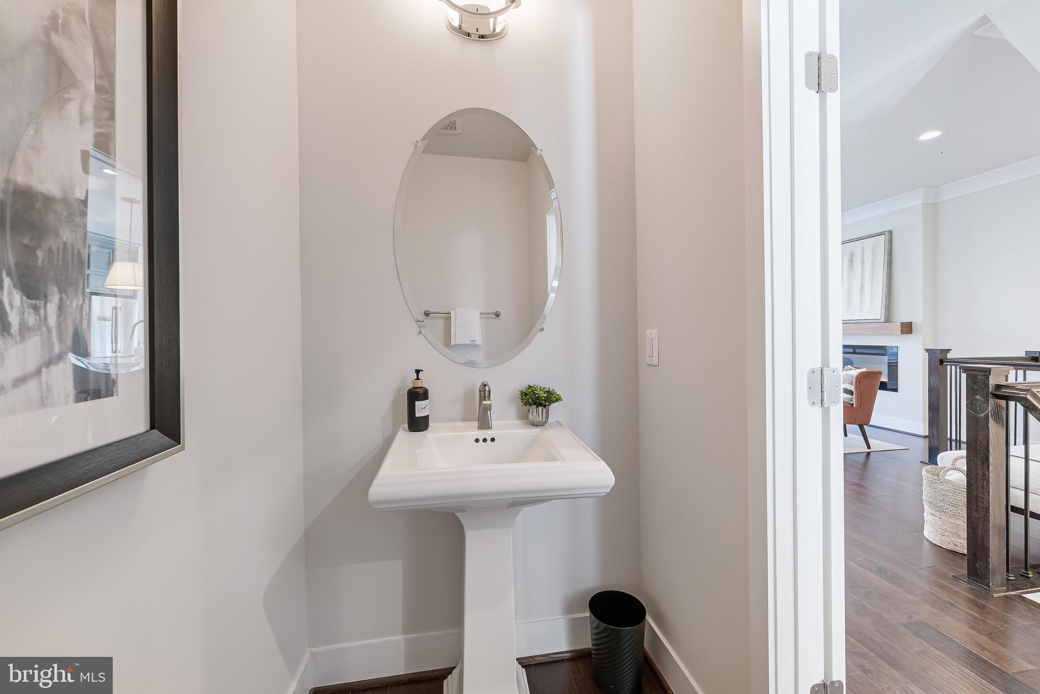 11695 Sunrise Square Place Reston, VA 20191 - Photo 15 of 72 a bathroom with a sink a mirror and a window