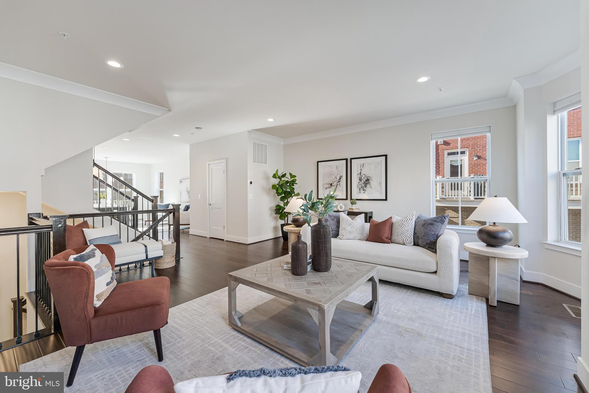11695 Sunrise Square Place Reston, VA 20191 - Photo 20 of 72 a living room with furniture or kitchen and a wooden floor