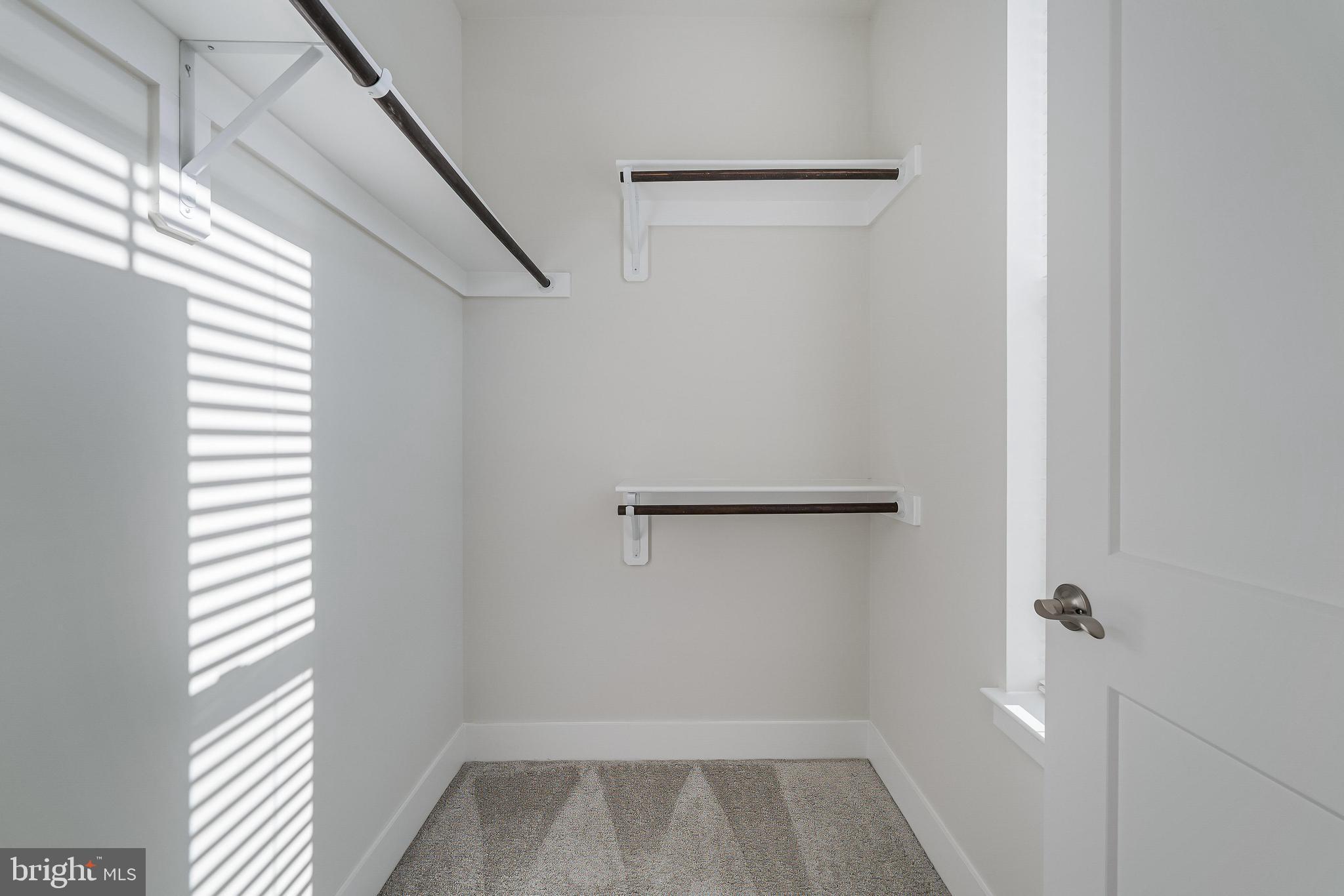 11695 Sunrise Square Place Reston, VA 20191 - Photo 46 of 72 a view of a room with rack on the wall and a window