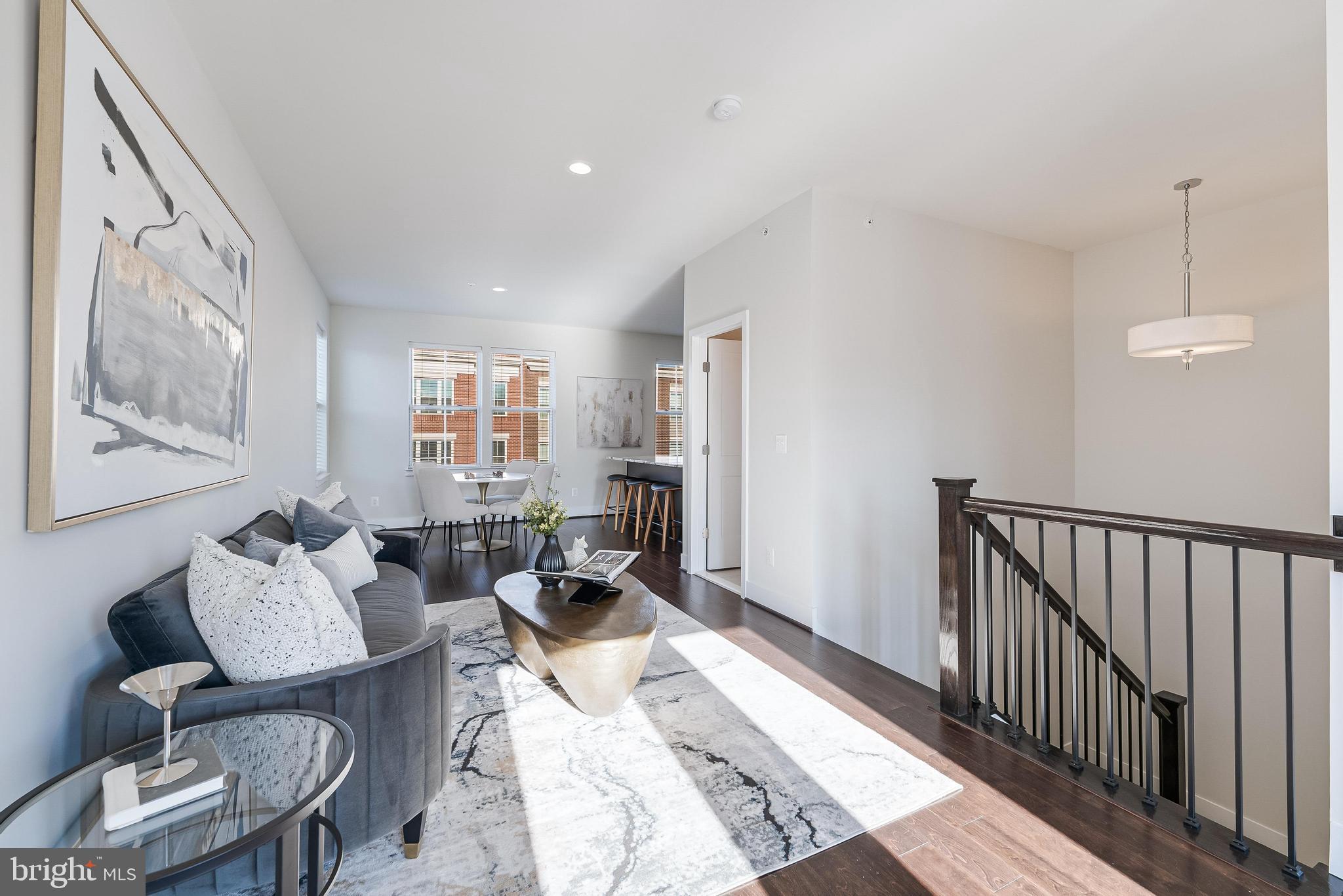 11695 Sunrise Square Place Reston, VA 20191 - Photo 52 of 72 a living room with furniture and wooden floor
