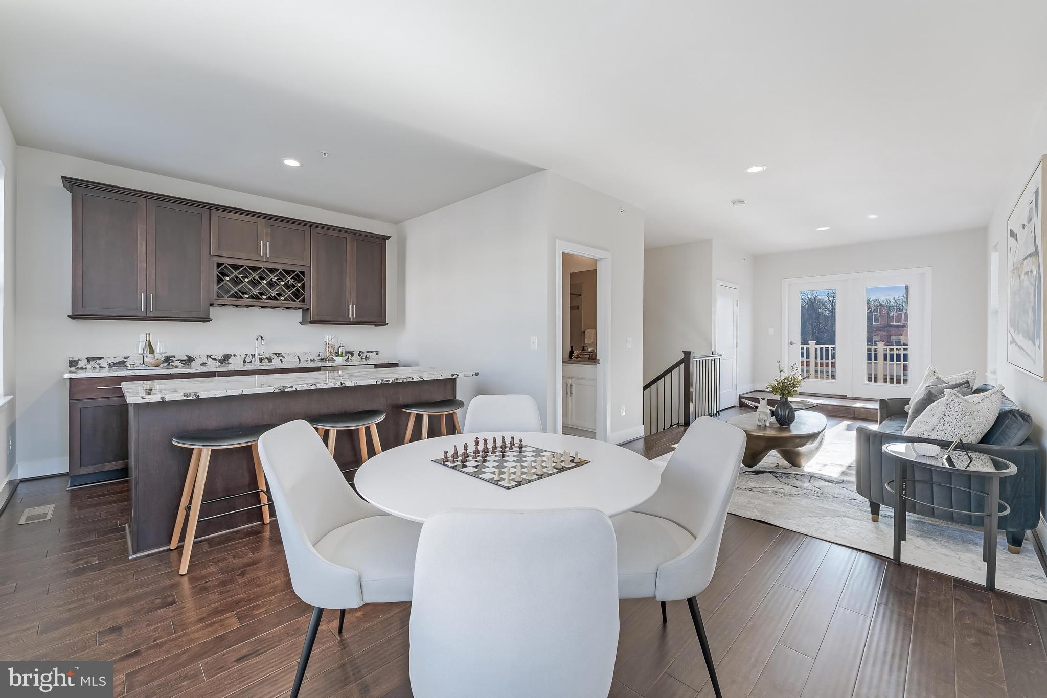 11695 Sunrise Square Place Reston, VA 20191 - Photo 54 of 72 a view of a dining room with furniture window and wooden floor