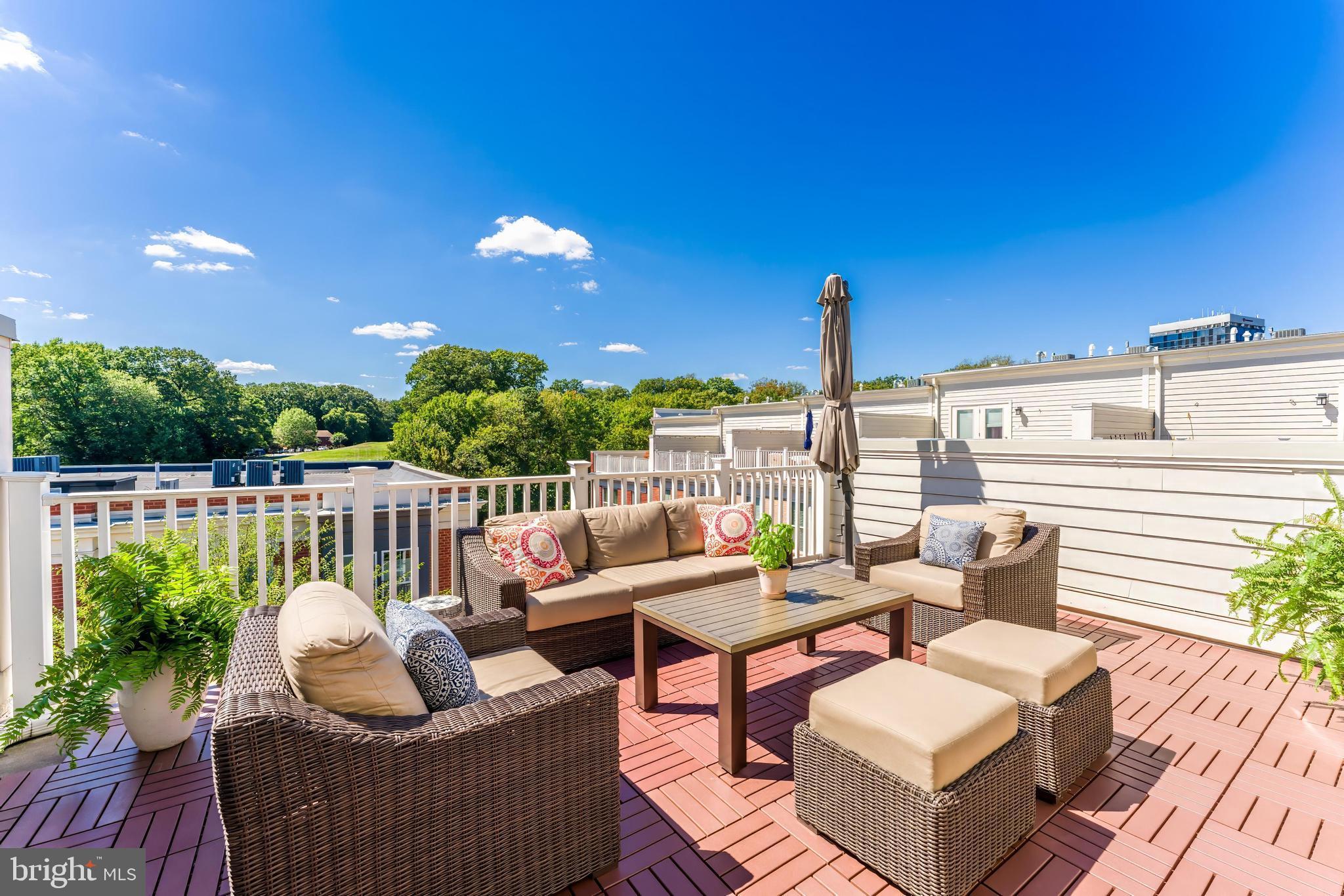 11695 Sunrise Square Place Reston, VA 20191 - Photo 60 of 72 a view of a patio with couches chairs and wooden floor