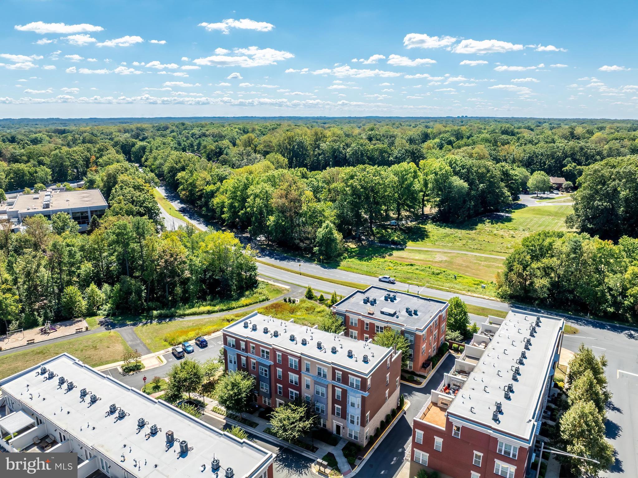 11695 Sunrise Square Place Reston, VA 20191 - Photo 70 of 72 a view of a balcony with wooden floor and outdoor space