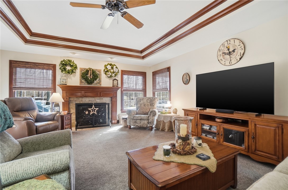 5300 Brookshire Lane Springfield, OH 45502 - Photo 9 of 56 This inviting living room showcases a beautiful fireplace and elegant tray ceilings.