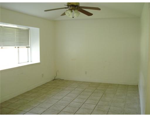 1112 Westcliff Drive Portland, TX 78374 - Photo 2 of 9 an empty room with a window