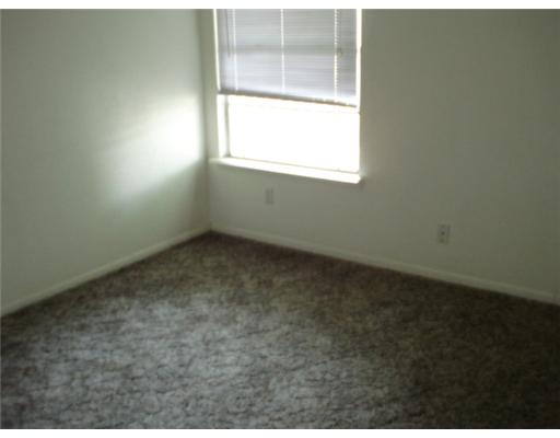 1112 Westcliff Drive Portland, TX 78374 - Photo 6 of 9 an empty room with a window