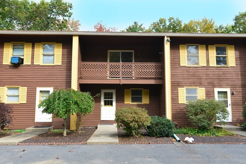 9 May Brook Road, Unit 9 Holland, MA 01521 - Photo 1 of 42 a front view of a house with a yard