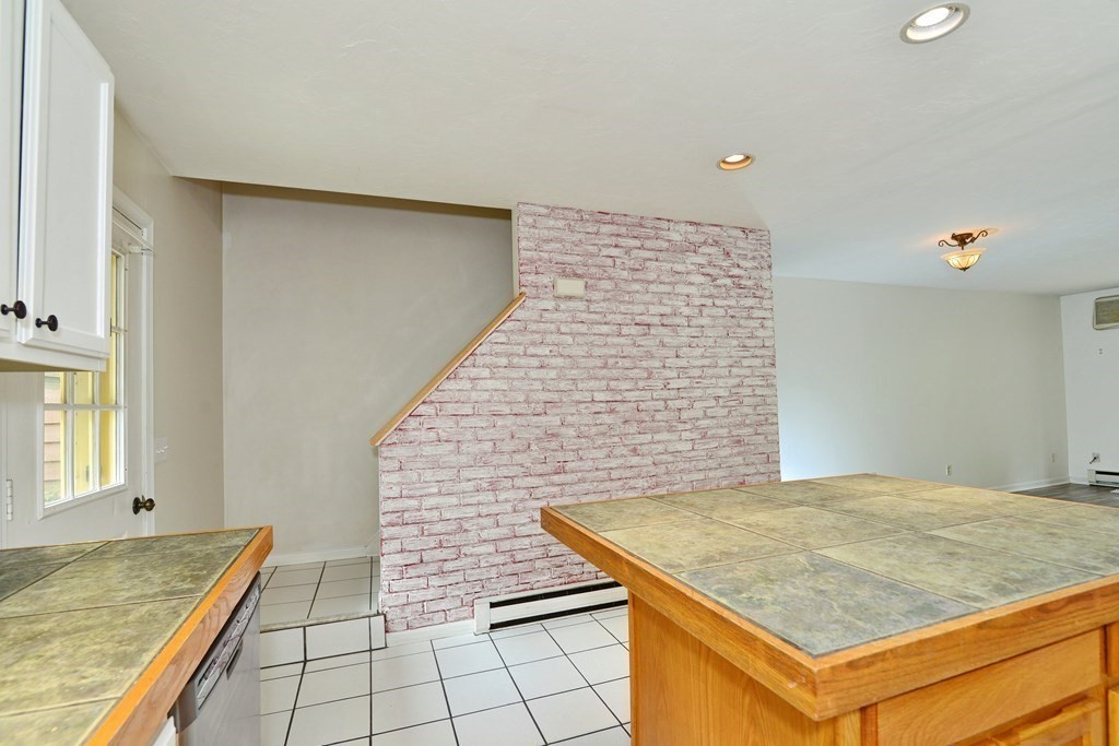 9 May Brook Road, Unit 9 Holland, MA 01521 - Photo 20 of 42 a bedroom with a stove and walk in closet