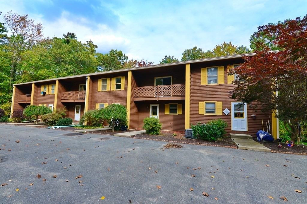 9 May Brook Road, Unit 9 Holland, MA 01521 - Photo 3 of 42 a front view of a house with a yard