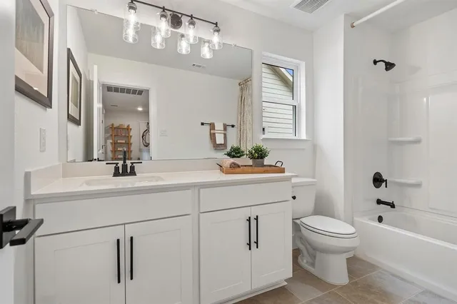a bathroom with a sink a vanity and a mirror
