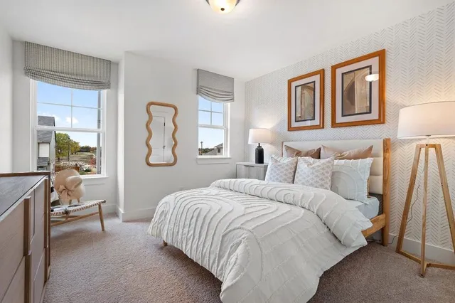 a view of a house with a wooden fence