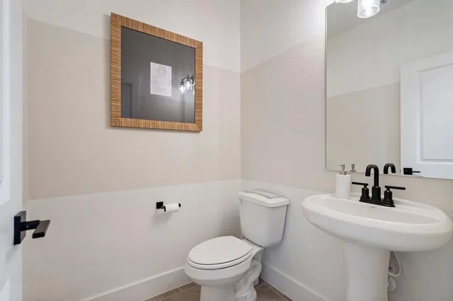a bathroom with a toilet and sink
