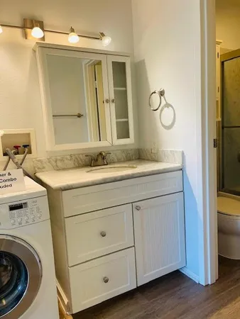 a bathroom with a sink and a mirror