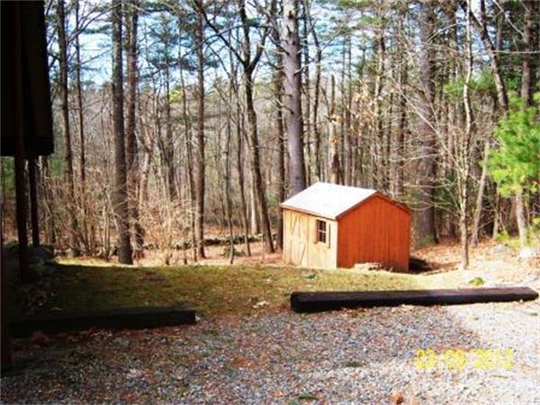 149 Judy Farm Road Carlisle, MA 01741 - Photo 5 of 10 a view of a house with a yard