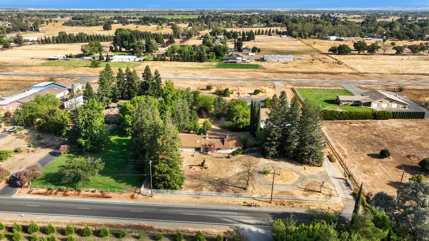 9537 Alta Mesa Road Wilton, CA 95693 - Photo 1 of 33 an aerial view of residential houses with yard