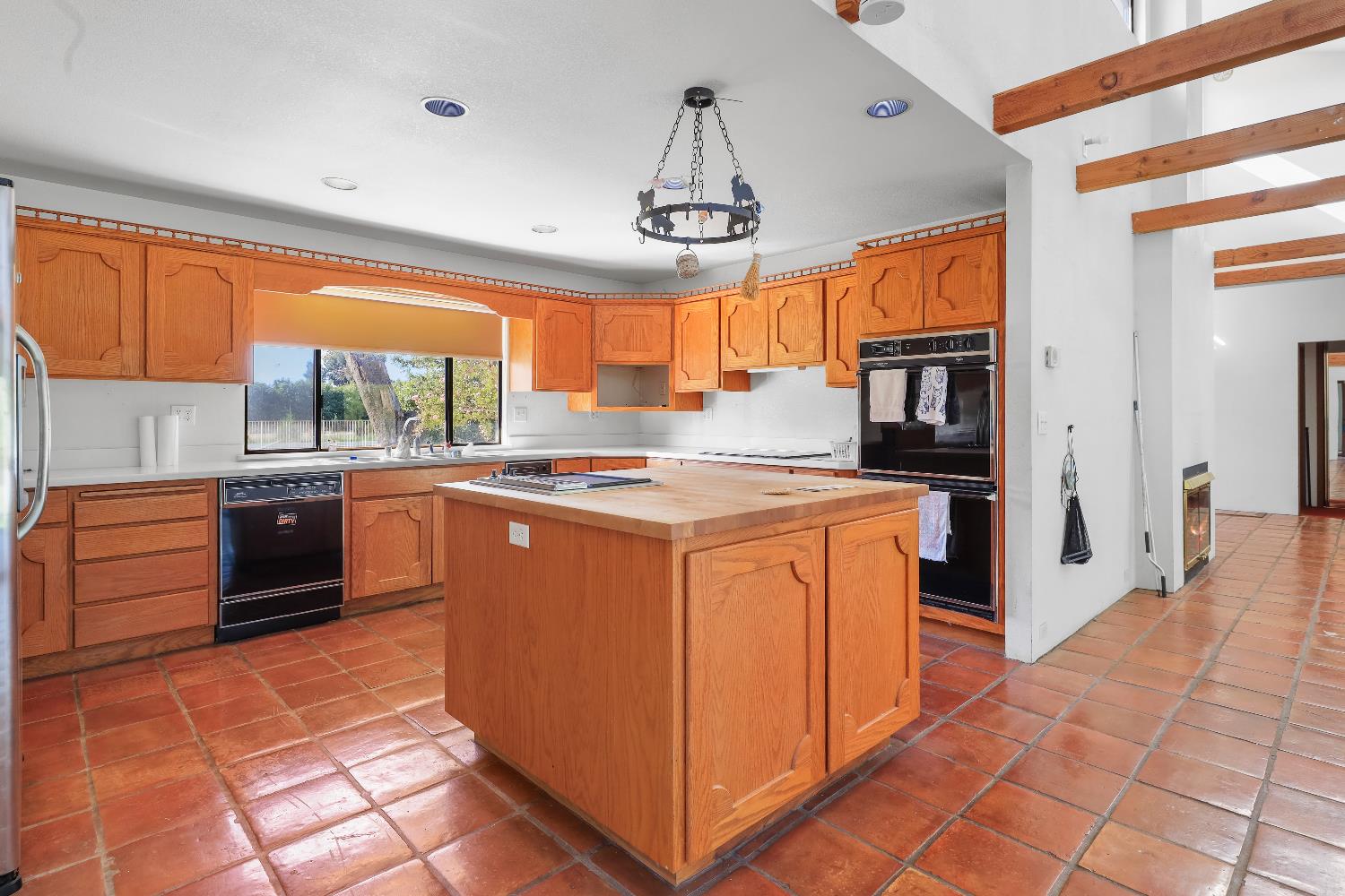9537 Alta Mesa Road Wilton, CA 95693 - Photo 15 of 33 a kitchen with stainless steel appliances granite countertop a stove a sink and a refrigerator
