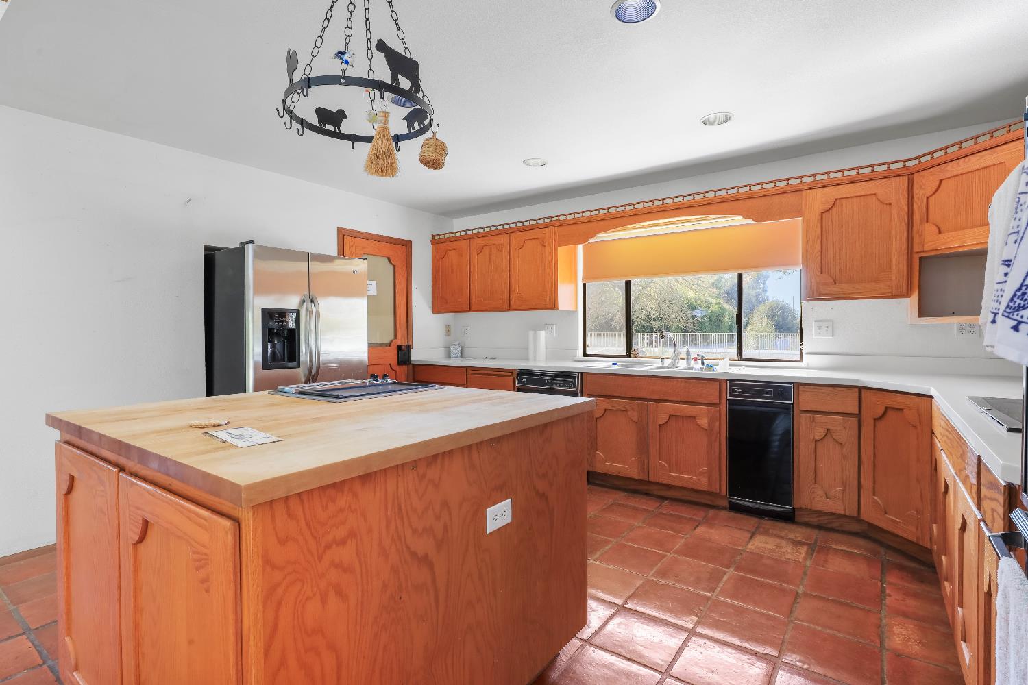 9537 Alta Mesa Road Wilton, CA 95693 - Photo 16 of 33 a kitchen with stainless steel appliances granite countertop a sink and a stove