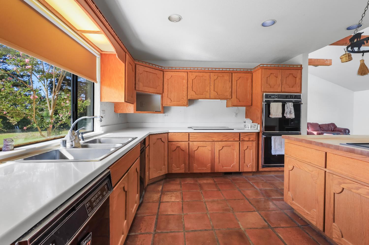 9537 Alta Mesa Road Wilton, CA 95693 - Photo 17 of 33 a kitchen with a sink stove and cabinets