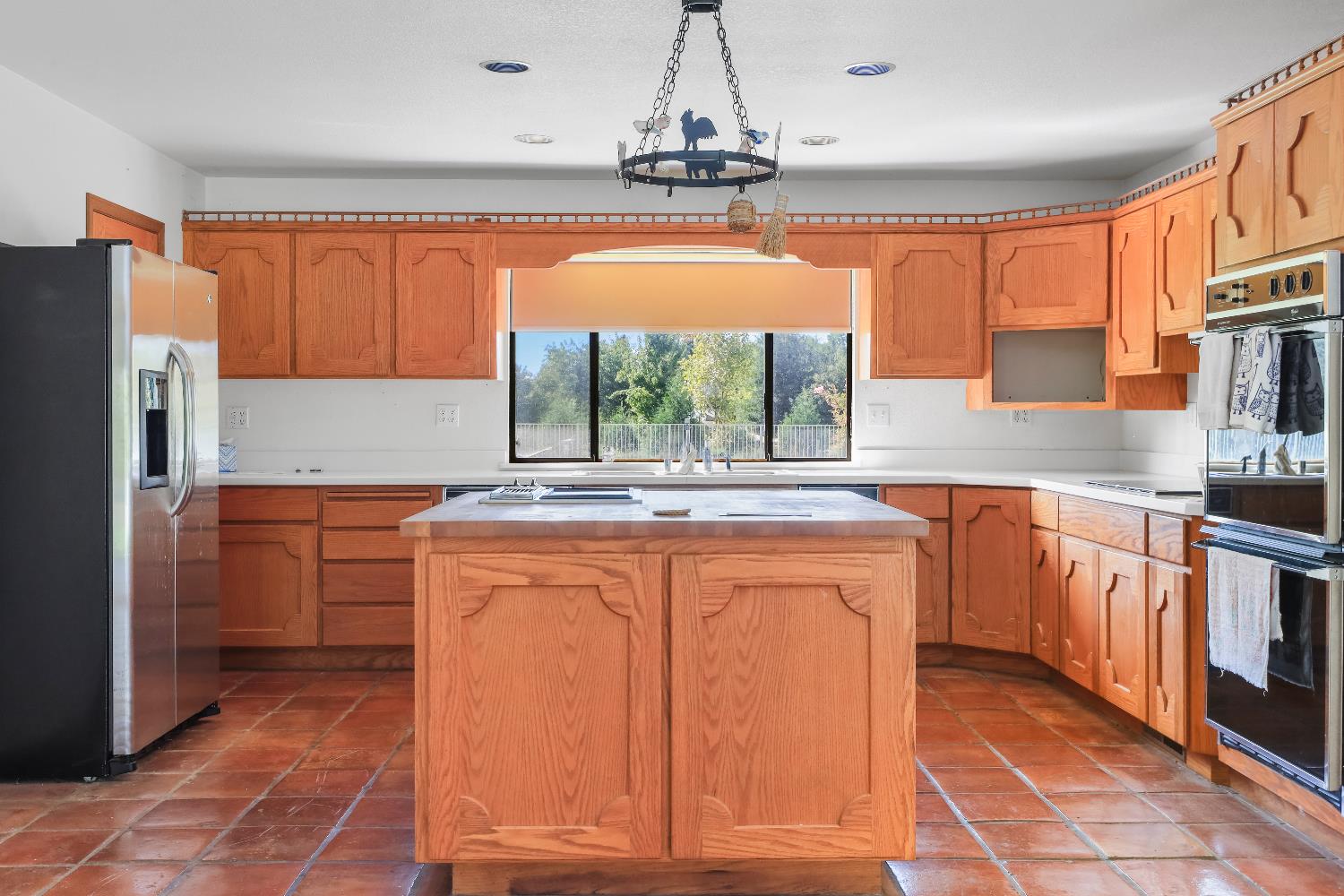 9537 Alta Mesa Road Wilton, CA 95693 - Photo 19 of 33 a kitchen with stainless steel appliances granite countertop a refrigerator and sink