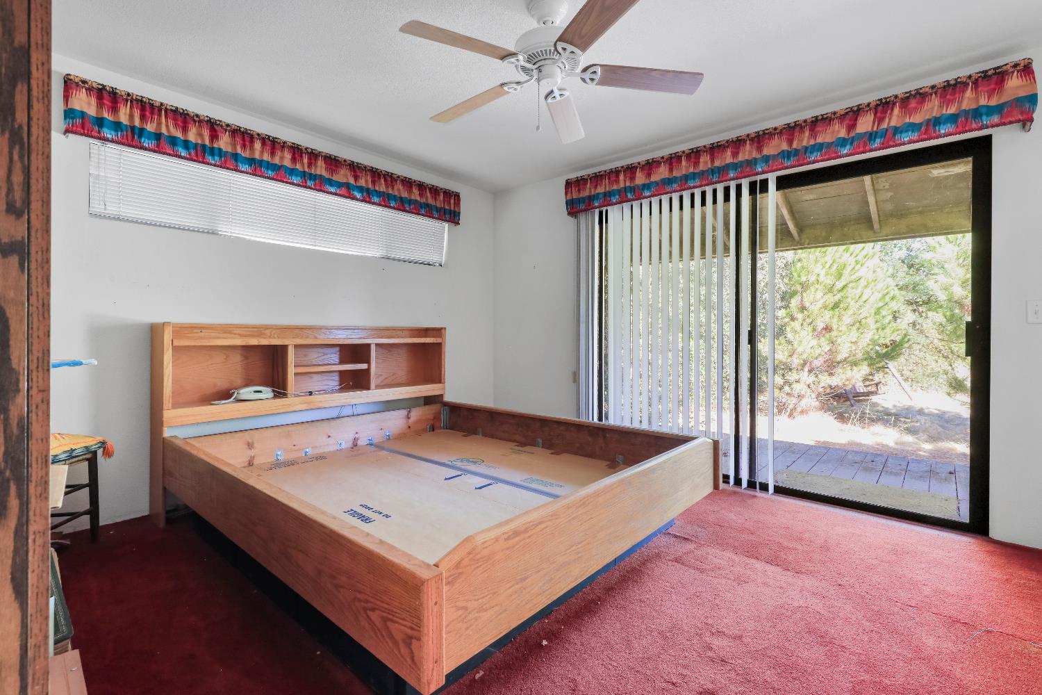 9537 Alta Mesa Road Wilton, CA 95693 - Photo 30 of 33 a living room with a bed and a table