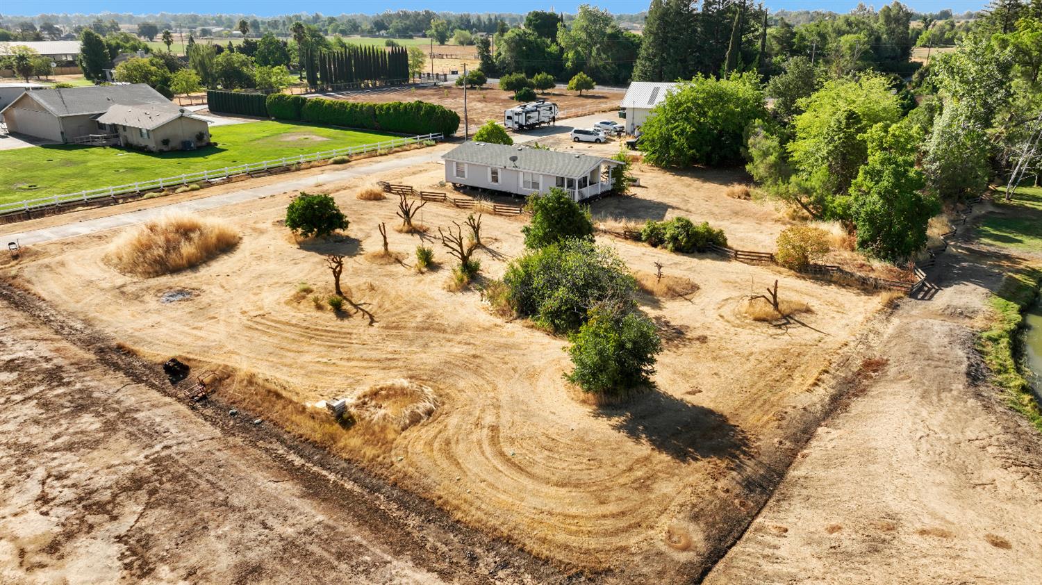 9537 Alta Mesa Road Wilton, CA 95693 - Photo 3 of 33 a view of a lake with a yard