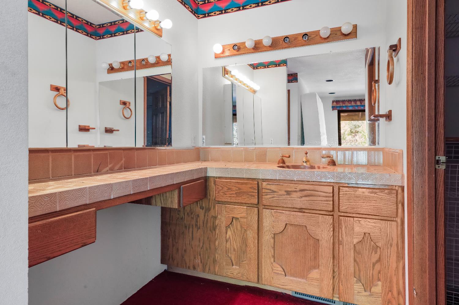 9537 Alta Mesa Road Wilton, CA 95693 - Photo 31 of 33 a bathroom with a sink and a mirror