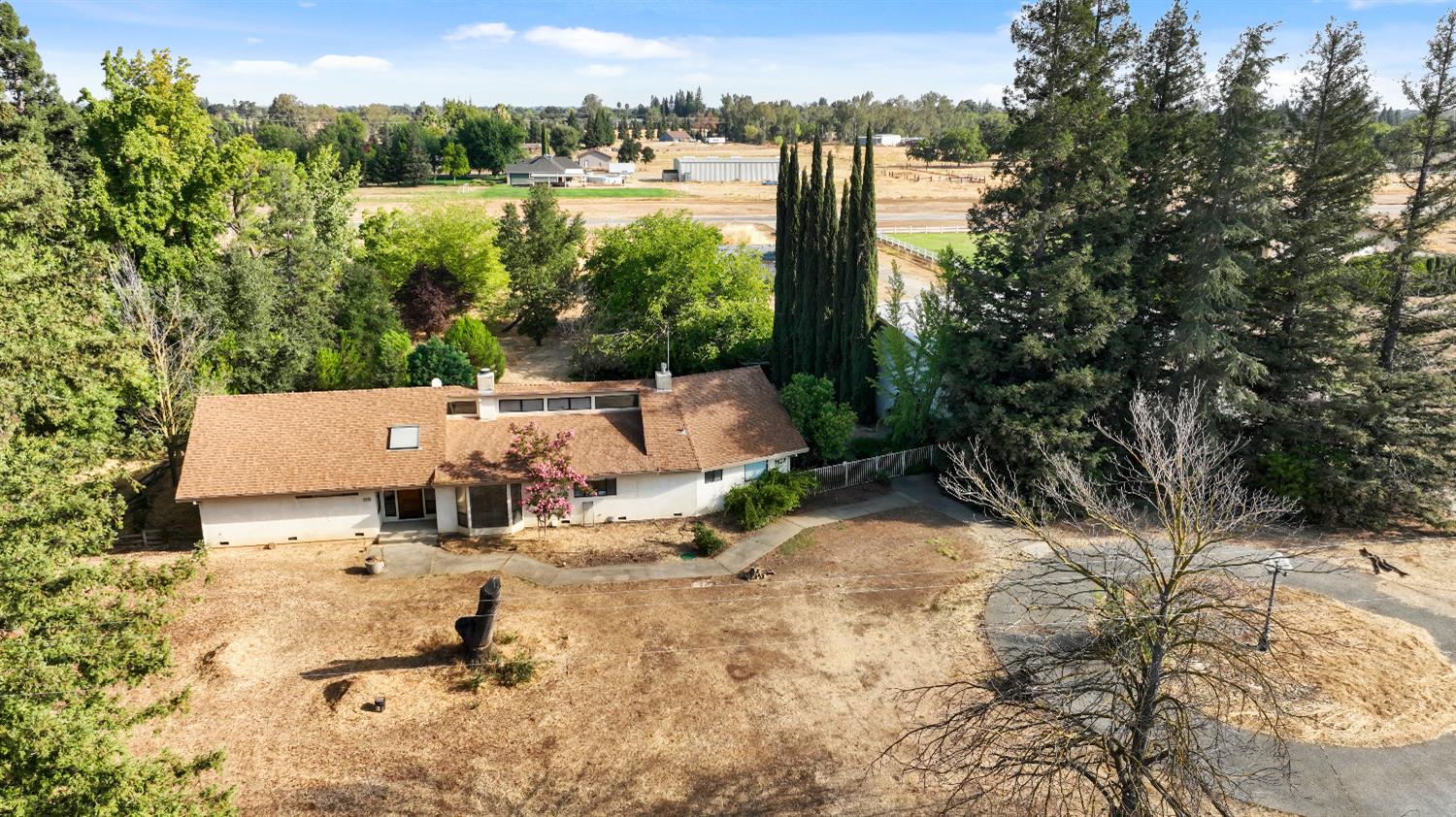 9537 Alta Mesa Road Wilton, CA 95693 - Photo 4 of 33 a view of a lake with couches and wooden fence