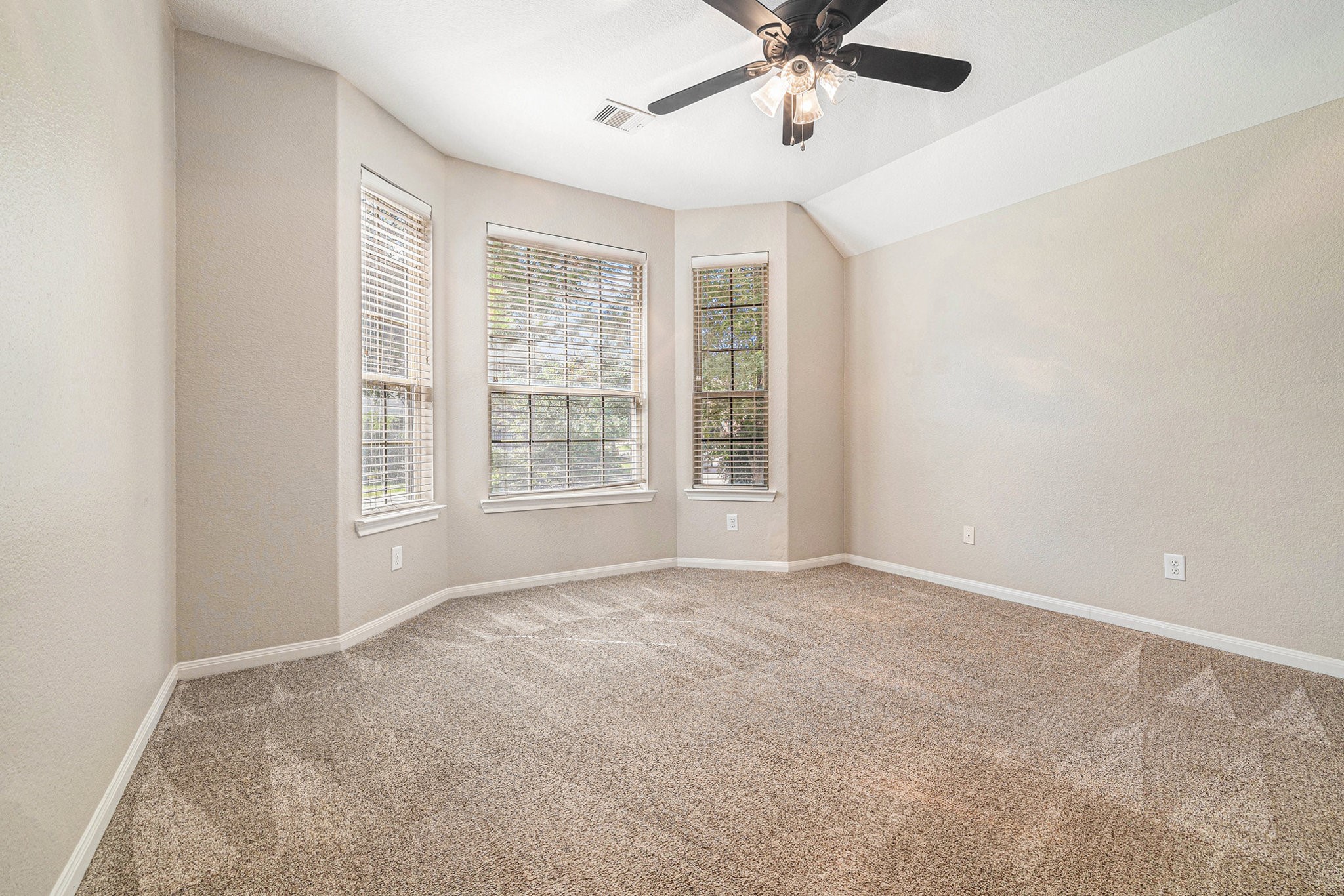 139 North Hawkhurst Circle Magnolia, TX 77354 - Photo 13 of 26 an empty room with windows and fan