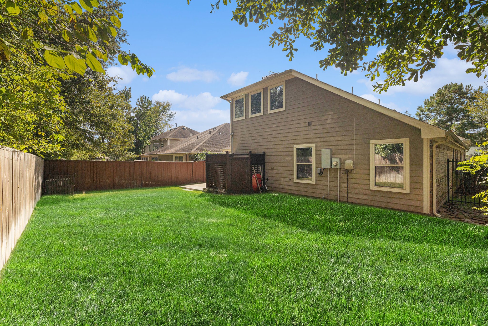 139 North Hawkhurst Circle Magnolia, TX 77354 - Photo 23 of 26 a backyard of a house with lots of green space