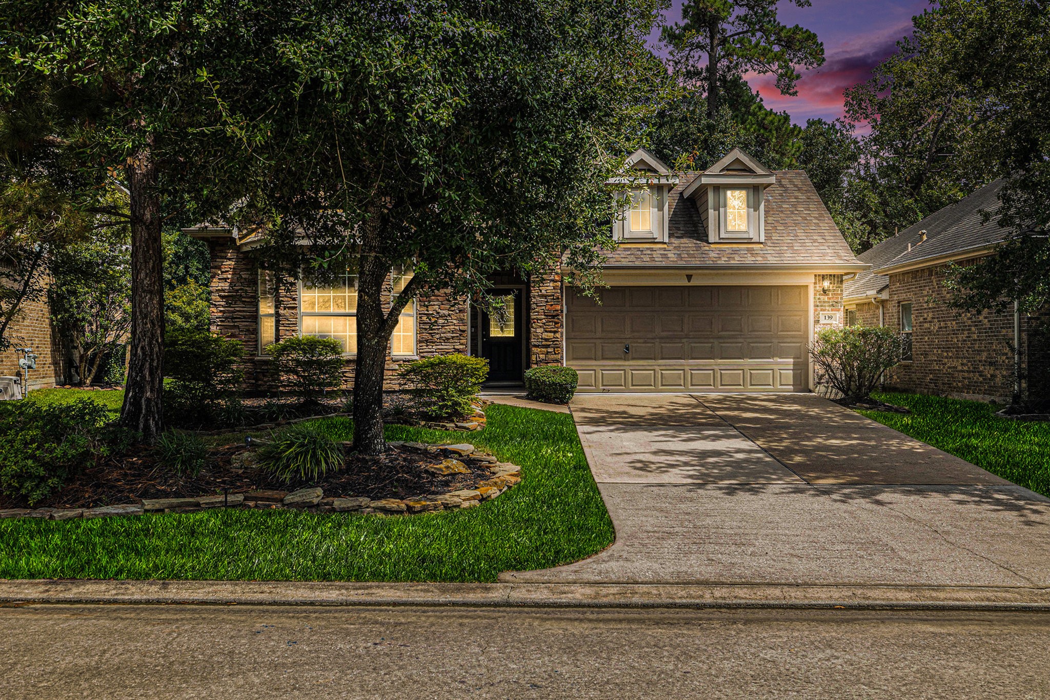 139 North Hawkhurst Circle Magnolia, TX 77354 - Photo 24 of 26 a front view of a house with a garden