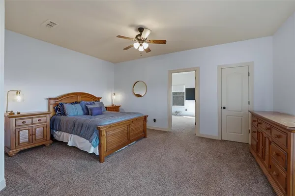 a view of a livingroom with furniture and a flat screen tv