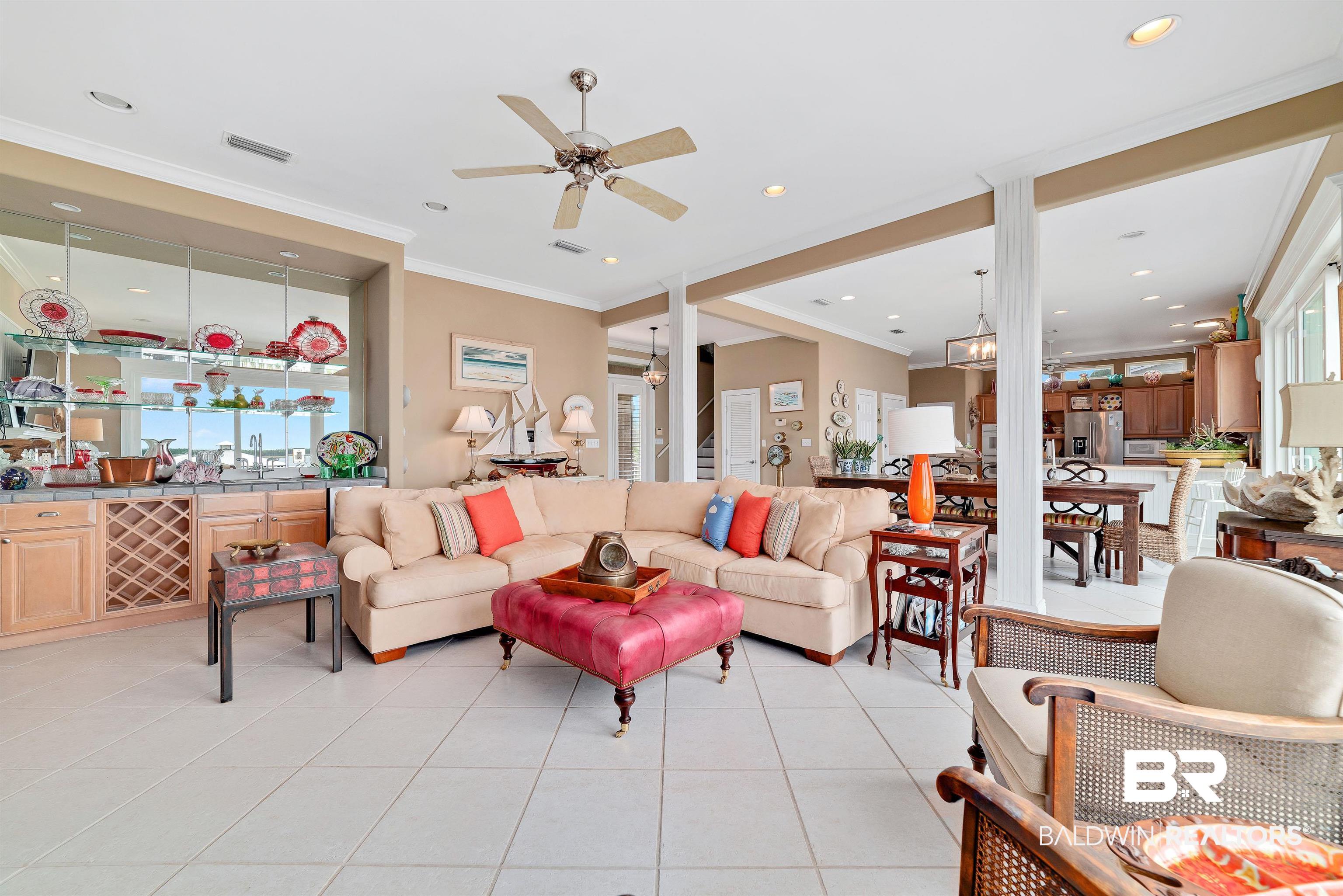 24513 Gulf Bay Road Orange Beach, AL 36561 - Photo 6 of 52 Tiled living room featuring ornamental molding and ceiling fan
