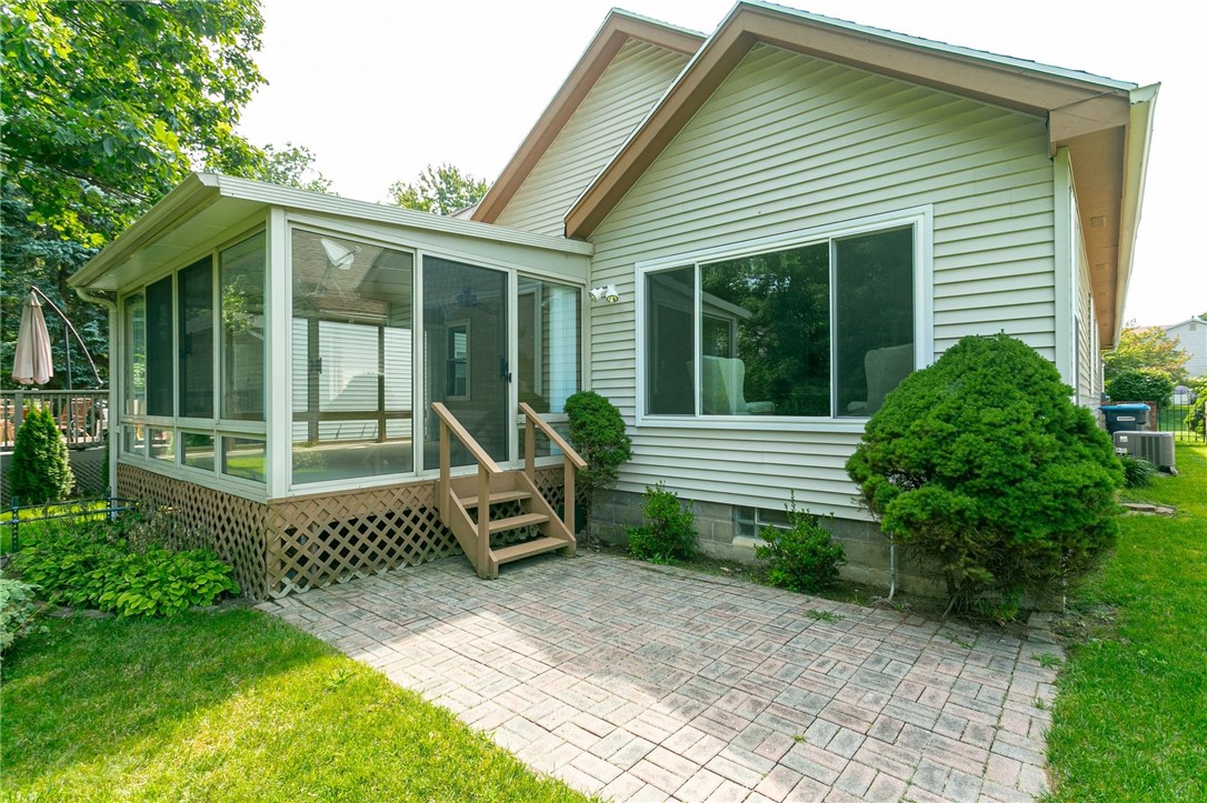 204 Webster Commons Boulevard Webster, NY 14580 - Photo 22 of 50 brick patio off the 3-season room