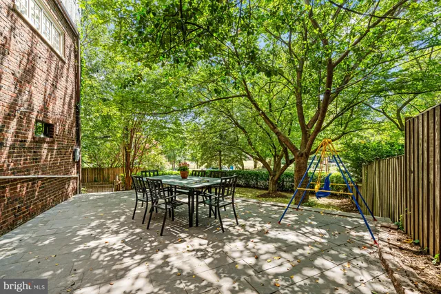 a view of backyard with sitting area