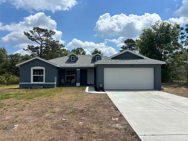 a front view of a house with yard