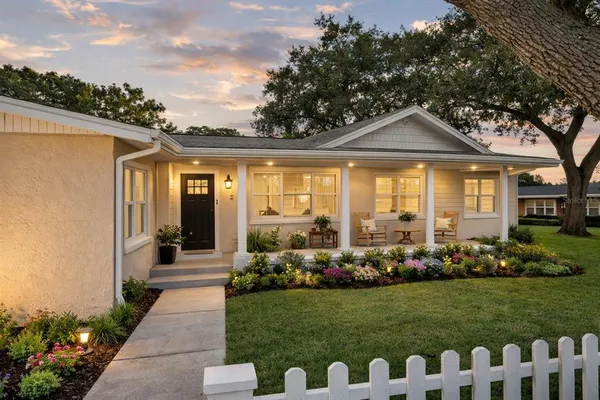 a front view of a house with garden