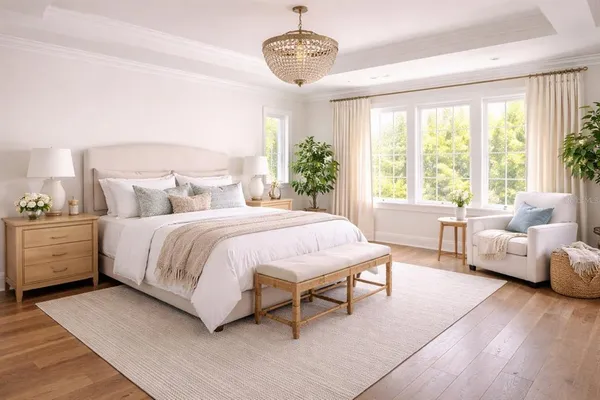 a spacious bedroom with a bed and a couch