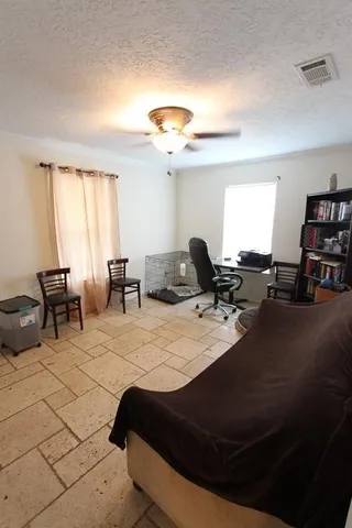 a room with furniture and a flat screen tv