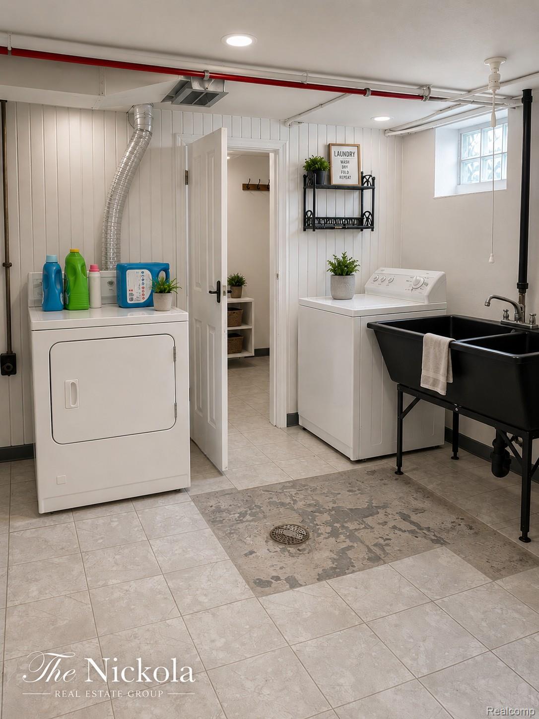 515 Barrington Road Detroit, MI 48215 - Photo 24 of 27 Laundry area featuring independent washer and dryer, recessed lighting, and wood walls
