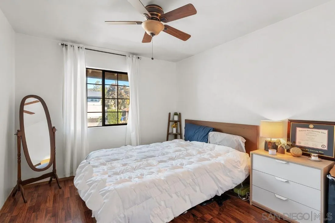 12814 Iola Way Poway, CA 92064 - Photo 18 of 36 a bedroom with a bed and a large window