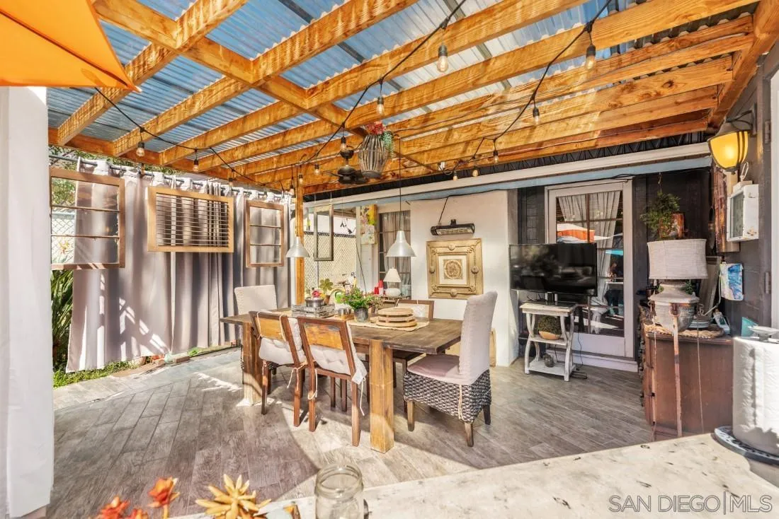 12814 Iola Way Poway, CA 92064 - Photo 27 of 36 a view of a patio with a dining table and chairs